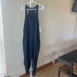 Nike women’s yoga training jumpsuit in black size medium NWT
